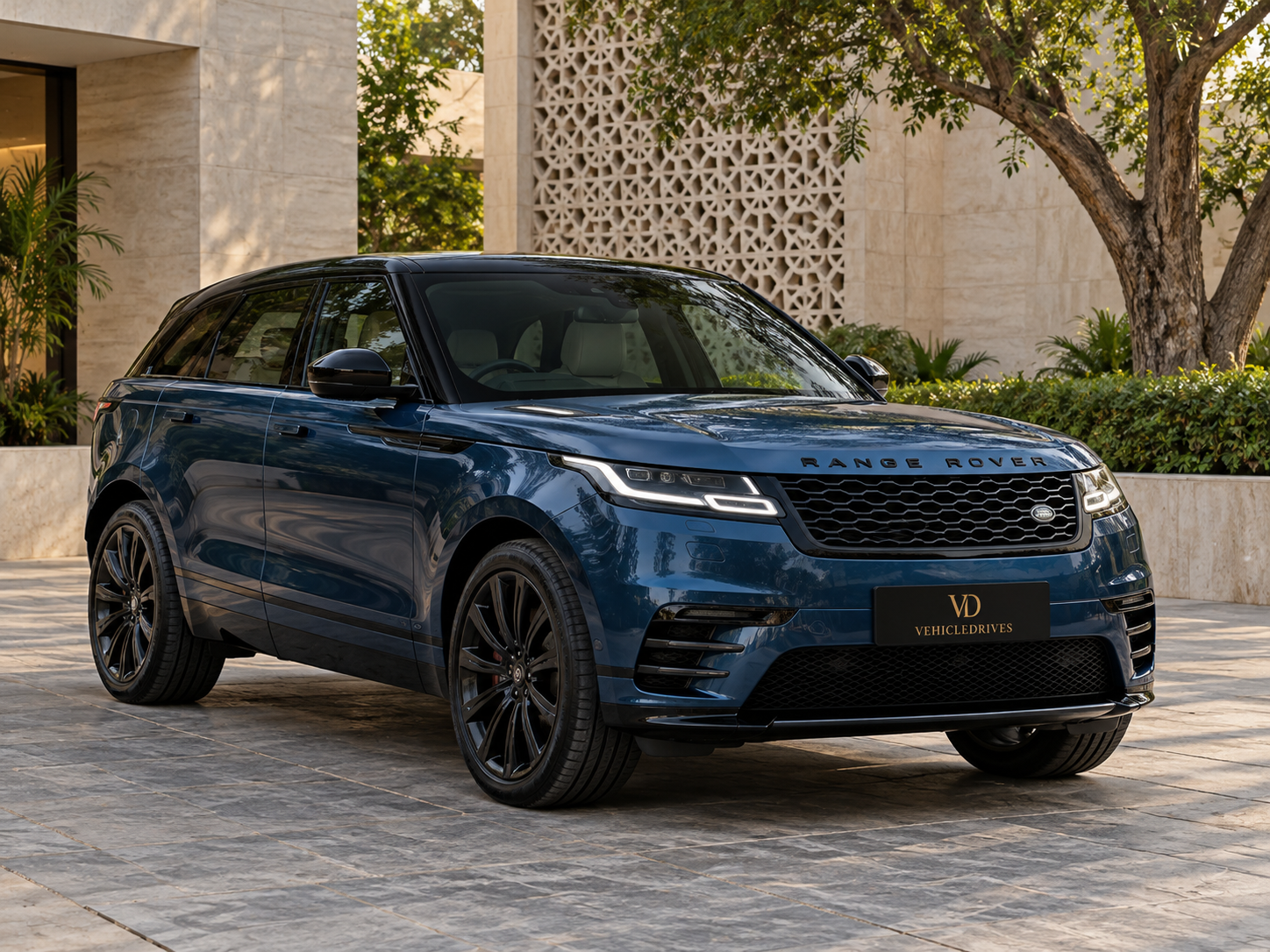 blue range rover velar in delhi courtyard