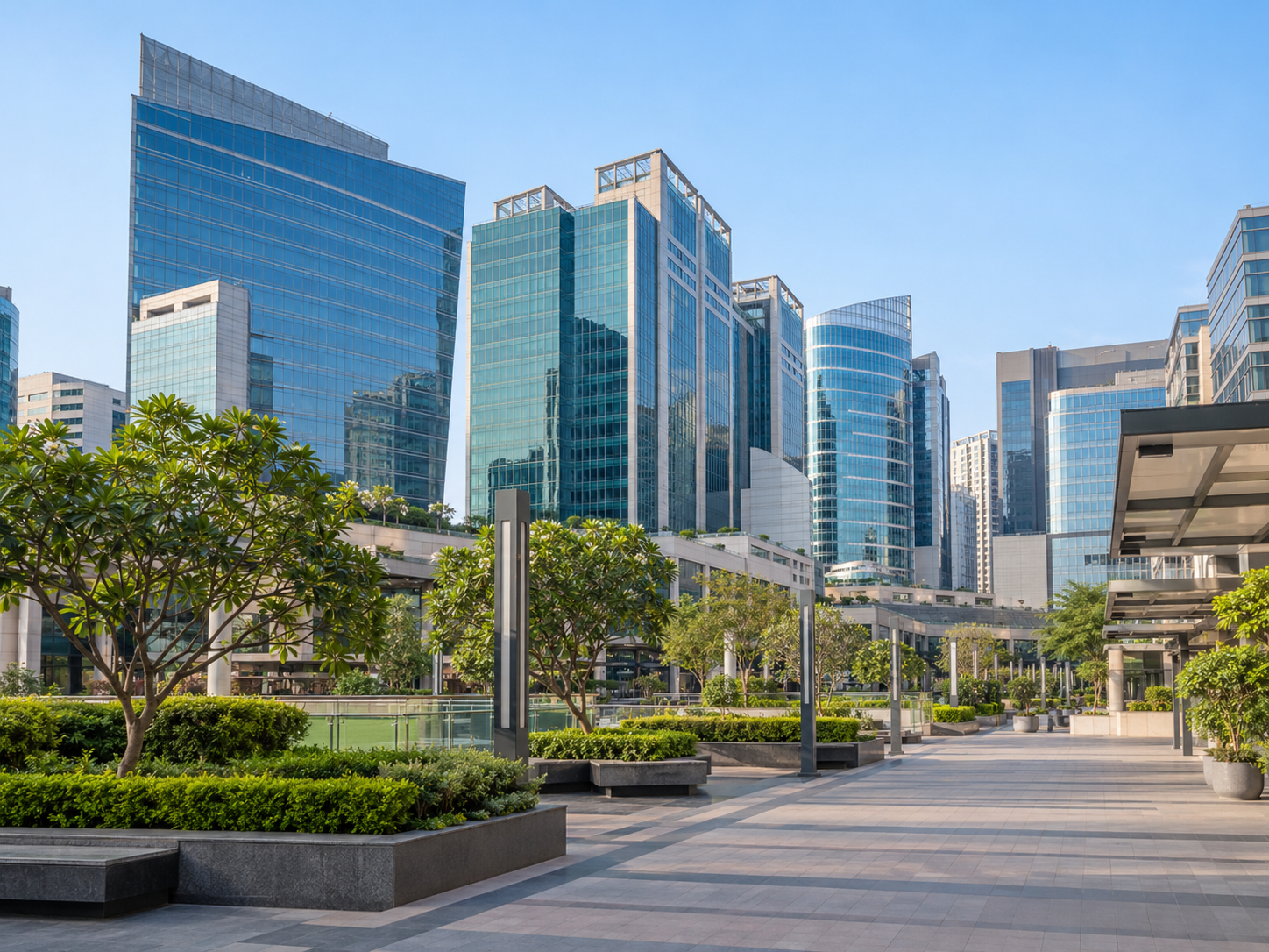 Glass office towers and landscaped walkways in Gurugram Cyber City